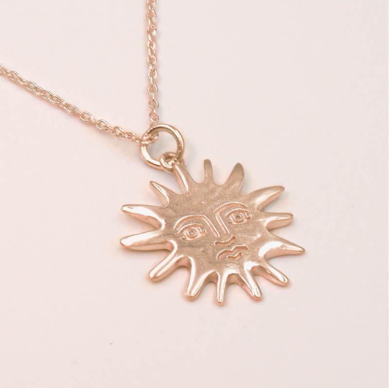 Small gold sun on sale necklace